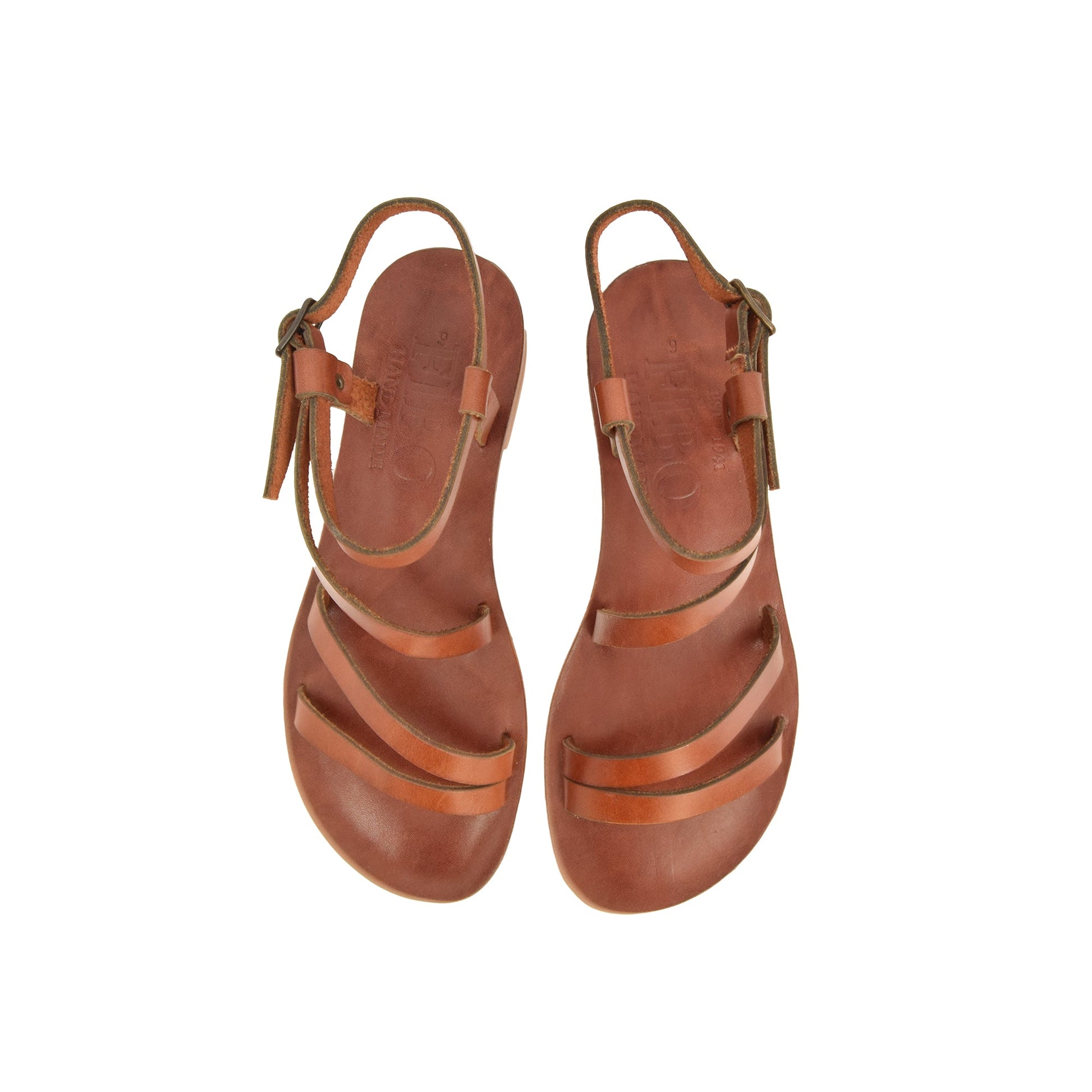 a pair of brown leather sandals